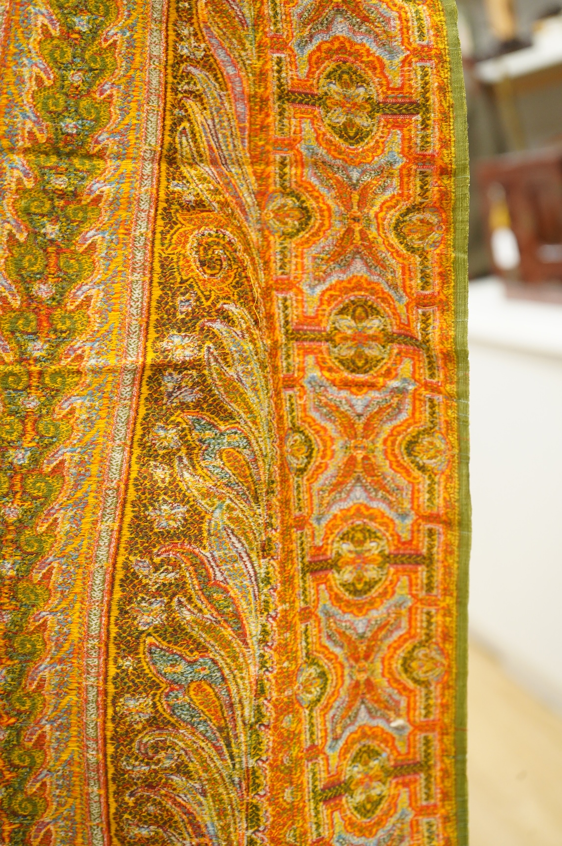 A French possibly Lyon, 19th century ornate silk and fine wool woven Paisley patterned shawl. Woven in polychromes coloured silks and wools on a jacquard loom, using an array of punch cards to create this elaborate desig